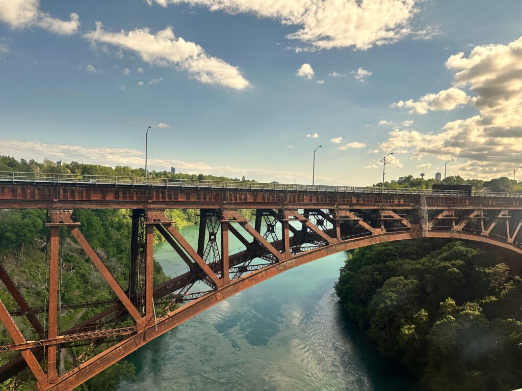 The view of the Niagara River and a bridge from Amtrak, facing roughly north